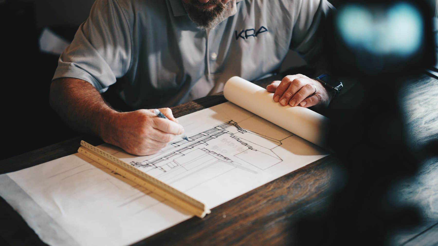 Renovation drawings and a timber rule on limestone